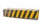 Striped black and yellow concrete road barrier