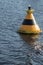 Striped buoy on the water