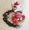 striped cup with tea on a saucer pieces of sugar cubes, semicircular spice, small wild strawberries and brewer with a poppy