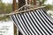 Striped hammock fragment. Outdoor rest background