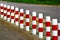 Striped red and white roadside safety posts