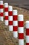 Striped red and white roadside safety posts