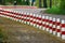 Striped red and white roadside safety posts