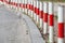 Striped red and white signal poles