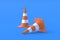 Striped traffic cones, barriers on blue background