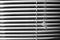 Striped window shuttering in light and shadow lines horizontal