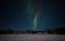 Stripes of aurora borealis in night sky