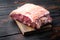 Striploin steak, raw beef butchery cut, on old wooden table