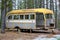 Stripped abandoned bus at a hunters camp on crown land