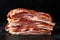 Stripy cured pork side bacon pancetta smoked on wood chip