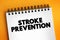 Stroke prevention text on notepad, medical concept background