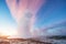 Strokkur geyser eruption in Iceland. Fantastic colors shine thro