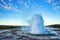 Strokkur Geysir Eruption with Bright Blue Sky, Iceland