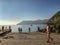 Strollers linger by the Mediterranean on a late October afternoon in Vernazza, Cinque Terre, Italy