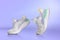 Strolling sports shoes on lilac color background. Sneakers or trainers isolated. Athletic shoes. fitness, sport