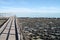 Stromatolites on shore with shallow water and boardwalk