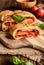 Stromboli stuffed with cheese, salami, green onion and tomato sauce