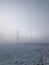 Stromleitungen im Nebel - Power lines in the fog