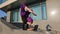 Strong acrobat business woman funny muslim girl in hijab stands on hands in acrobatic yoga pose asana balance handstand