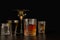 Strong alcoholic drinks, glasses and glasses, in the presence of whiskey, vodka, rum, tequila, brandy, cognac. on a dark old backg