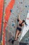 Strong ambitious girl attending climbing classes