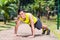 Strong Asian man doing sport push-up in park