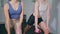 Strong athletes training dumbbells at home studio closeup. Women exercising body