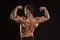 Strong Athletic Man Fitness Model posing back muscles, triceps,