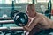 Strong athletic man make exercise with the preacher curls