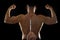 Strong back of young body building sportsman using steroids for increasing sport athletic performance