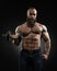 Strong bearded bodybuilder with six pack, perfect abs, shoulders