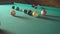 Strong blow to the center of the pyramid in American billiards