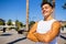 Strong brazilian man with a helathy body using spf cream in sunny day at beach