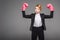 strong businesswoman posing in boxing gloves,