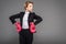 strong businesswoman posing in suit and pink boxing gloves,