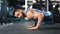 Strong caucasian guy making plank or push ups exercise,