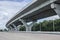 Strong concrete piers of new high main road with forest