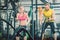 Strong couple exercising together with battle ropes during functional training