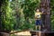 Strong excited young boy playing outdoors in rope park. Caucasia