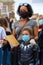 A strong female leader wears a Black Lives Matter PPE face mask along with her Superhero son at a BLM protest in Richmond, North