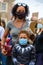 Strong female leader wears Black Lives Matter PPE face mask and hugs Superhero son at BLM protest in Richmond, North Yorkshire