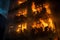 Strong fire, a house engulfed in flames with people silhouettes on the balcony, victims of the tragedy being evacuated