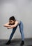 Strong and Fit Athletic Woman in Sport Top and Shorts is Doing Push Up Exercises in a Loft Style Industrial Gym with Motivational