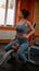 Strong and Fit Athletic Woman in Sport Top and Shorts is Doing Push Up Exercises in a Loft Style Industrial Gym with Motivational