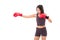 Strong fitness woman boxer or fighter punching at blank space