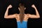 Strong fitness woman showing back biceps muscles