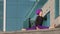 Strong flexible sports muslim young girl yogi woman doing workout exercises practice in city asana yoga pose of three
