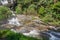 Strong flow with rain-like mist and rainbow in the spray of Wachirathan Waterfall in Doi Inthanon National Park,Chom Thong