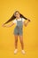 Strong hair. spring kid fashion. cheerful little girl yellow background. retro child long hair. small girl vintage look