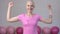 Strong and happy breast cancer survivior woman showing biceps - breast cancer awareness concept